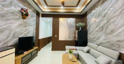 Phòng khách nhà Gò Vấp đường Quang Trung, Phường 10 thiết kế rộng rãi.