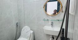 Nhà vệ sinh tầng trệt ốp gạch sạch sẽ của nhà phố Quận Gò Vấp
